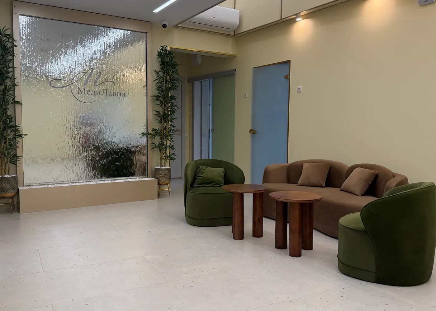 The clinic lobby with a water wall and a waiting area