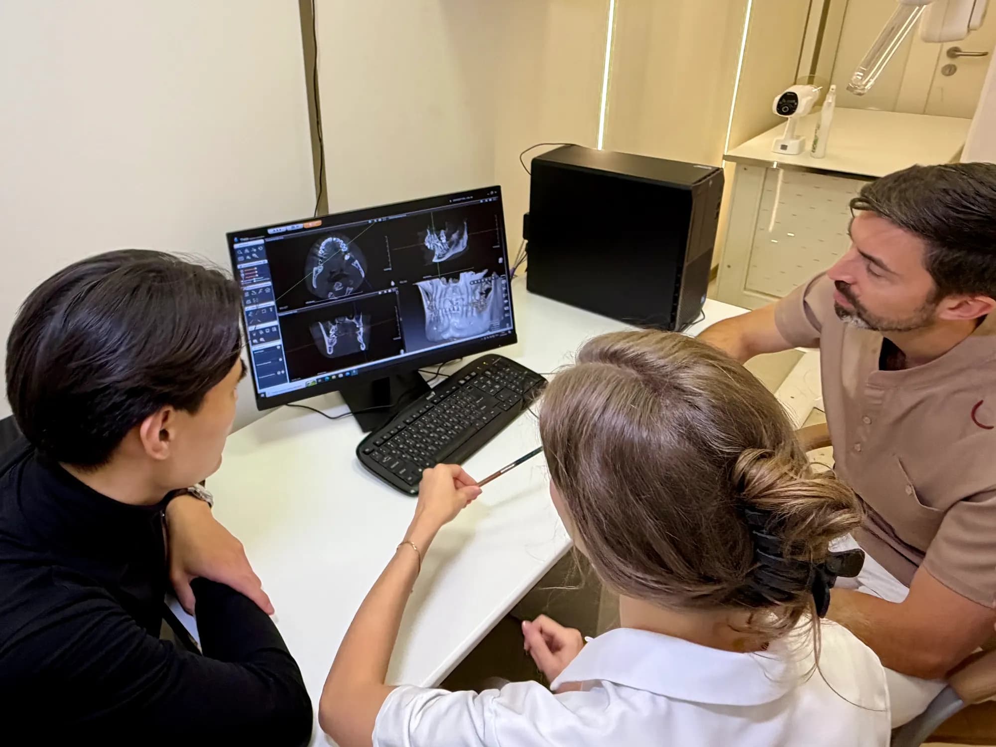 Reviewing CT scans on a monitor in a doctor's office